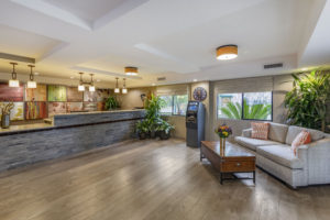 Anaheim Inn Hotel Lobby with front desk and seating area