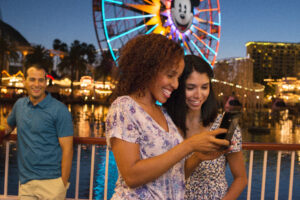 People on their phone at Disney California Adventure Park